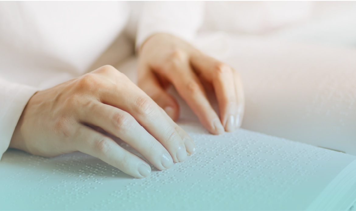 Close-up of hands reading and tracing Braille text, showcasing the tactile language for the visually impaired. Provided by Home Not Alone Caregiver Services for individuals with intellectual disability (IDD) within Community for Disabled Adults and accessible family group homes in Allegheny County, Pittsburgh, Pennsylvania.